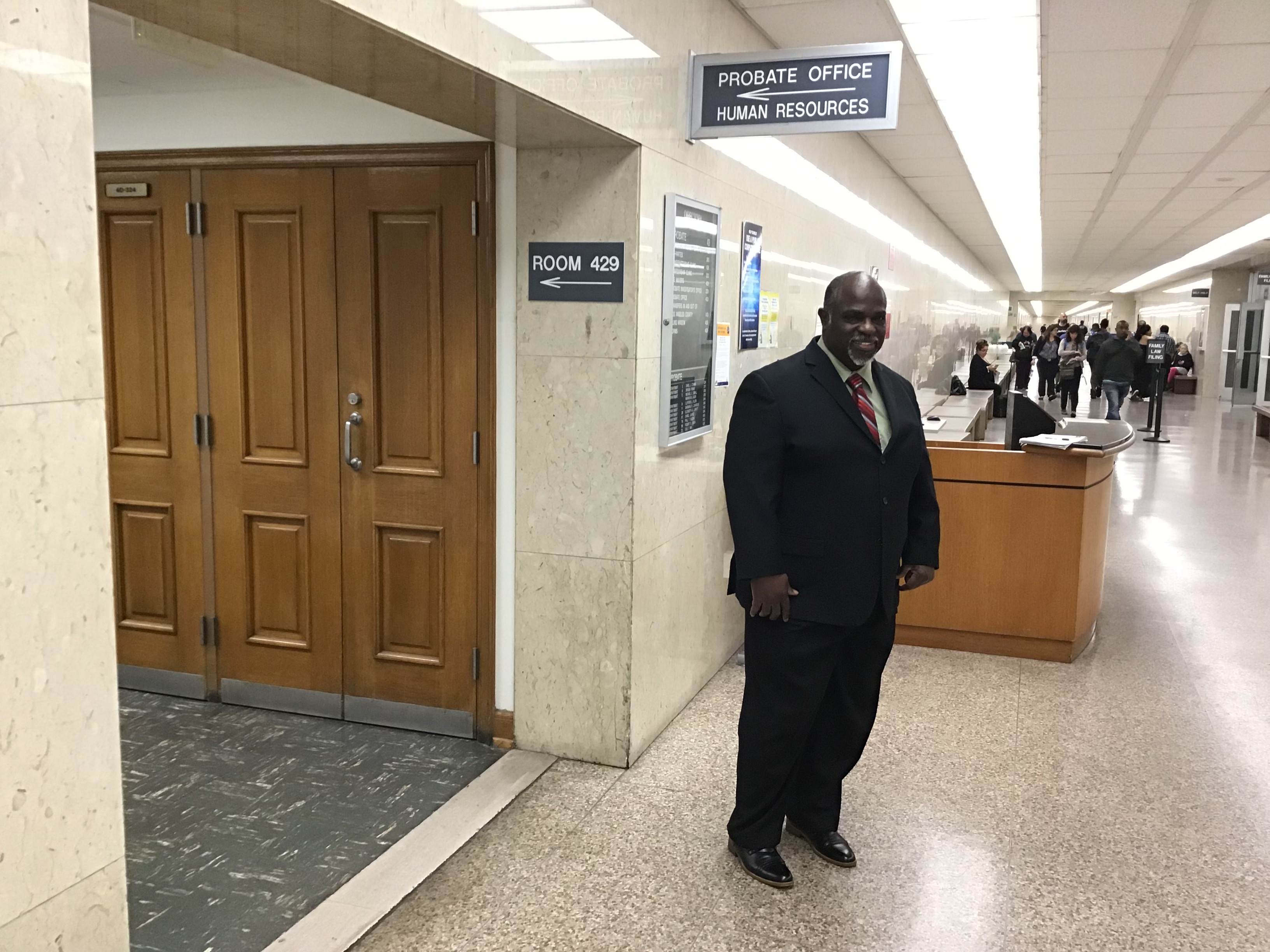 Picture of Samuel Mark in front of the probate office in the Courthouse