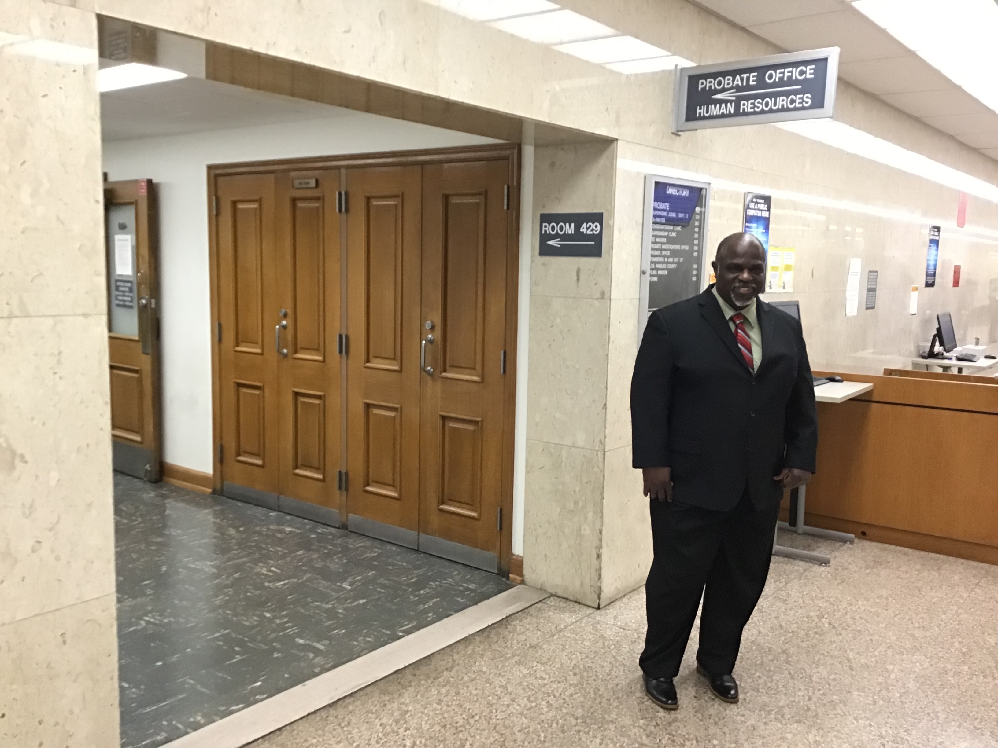 Second picture of Samuel Mark in front of the probate office in the Courthouse